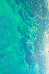 A Drone Shot of a Turquoise and Blue Sea Surface. Concept The vibrant and deep colors of the ocean.