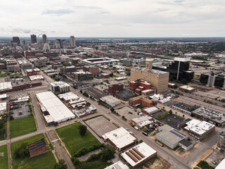 Cityscape photo from a drone of downtown St. Louis, MO city on a bright and beautiful summer day with skyscraper buildings and streets in the background.