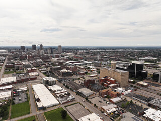 Cityscape photo from a drone of downtown St. Louis, MO city on a bright and beautiful summer day with skyscraper buildings and streets in the background.