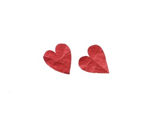 Group of red paper hearts scattered on white background. Heart shaped paper with the concept of feelings and love. Red paper hearts as background or copy space for text and design.