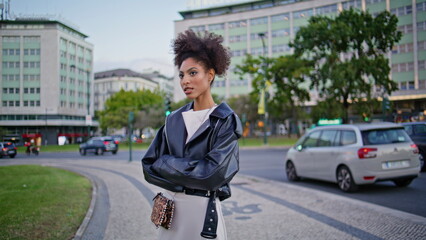 Classy woman standing street near road traffic. Beautiful african american lady 