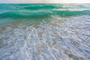 Ocean wave motion on sea shore. Summer sea breeze. Sea nature backdrop. Peaceful ocean. Dreamy ocean horizon. Coastal ocean paradise wallpaper. Seafoam waves. Summer tropical travel.