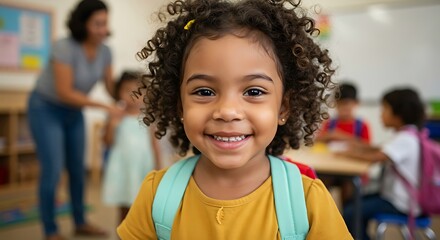 Smiling girl with backpack in classroom ready for school