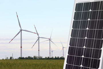 Solar panel and wind turbines outdoors. Alternative energy source