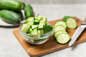 Cucumber on wooden background. Slice of cucumber on background. Fresh organic green cucumbers...