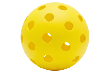 Close-up of a bright yellow plastic pickleball with holes isolated on a transparent background