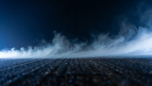 Mysterious blue vapor flows across a textured surface creating a dramatic and atmospheric effect perfect for abstract backgrounds