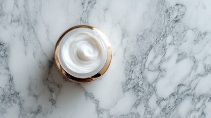 Top view of a jar of cream placed on marble with space for text