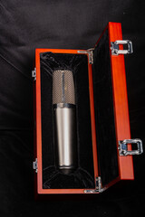 Studio microphone silver professional in a wooden box