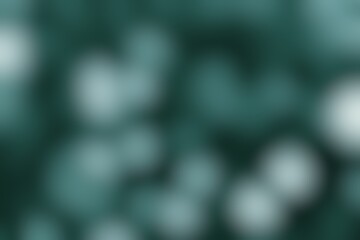 Abstract teal gradient background with soft, blurry spots of diffused light effect illumination