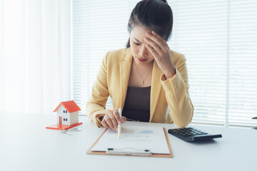 Financial Stress: A professional woman is overwhelmed by the complexity of financial documents,...