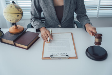 Legal Precision and Justice: A composed lawyer examines a contract with a gavel poised, conveying...