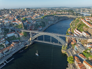 Obraz premium Dom Luis Bridge in Porto City, Portogal. Drone. Douro River. Downtown in Background