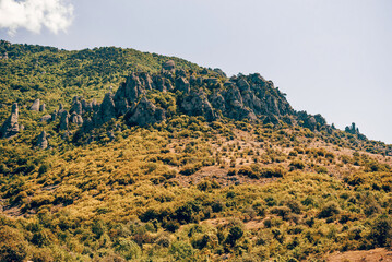 Landscape of Crimea mountains, mountain range in haze summer Valley of Ghosts
