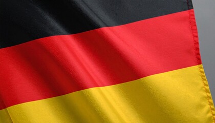 Naklejka premium German flag in close-up, showing horizontal black, red, and gold stripes.