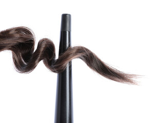 Naklejka premium Curling iron with brown hair lock isolated on white