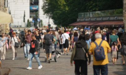 Blurred street with people in old town.