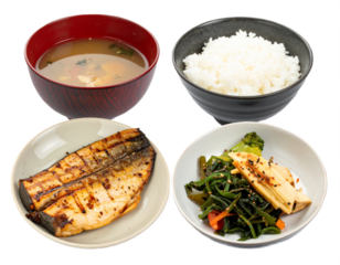 Delicious Japanese set meal features grilled fish, miso soup, rice, and vegetable side dish