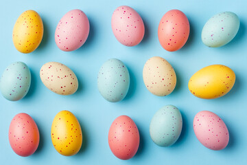 Pastel Easter eggs arranged on a blue background a spring holiday treat