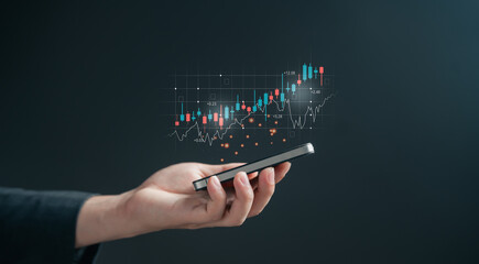 Business hand holding a smartphone with a digital hologram