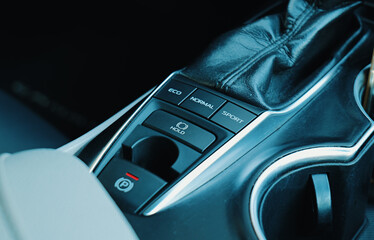Interior of a modern car showing drive mode selector and controls