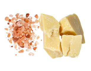 Unrefined cocoa butter chunks and Himalayan pink salt crystals for natural skincare products DIY ingredients