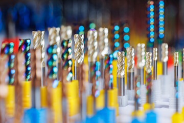 Assorted cnc machine drill bits in vibrant holders for precision cutting