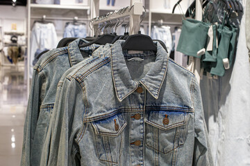 A denim jacket. A fashionable casual clothing store.