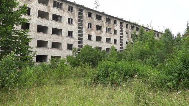 Irbene, Latvia A man explores abandoned Soviet apartment buildings.