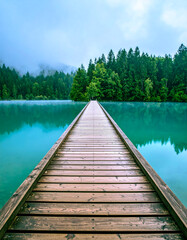 pier to the lake and mountain background