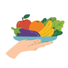 Hand holding a bowl of fruits and vegetables including an apple orange banana and eggplant in a bowl