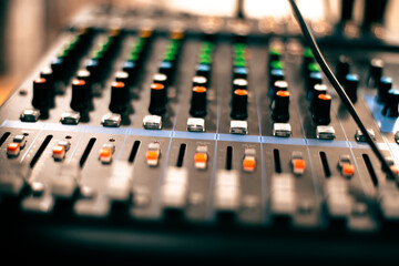 Mixing consoles are devices for creating high-quality sound. control of sound sources at concerts and holidays. Audio channel strips and frequency and volume control sections. High quality photo