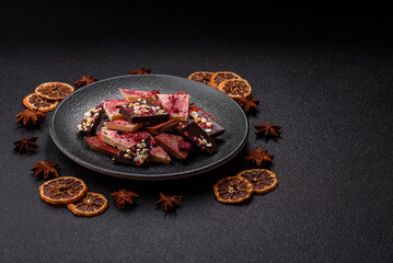 Bar sweet craft artisan chocolate with dried fruits made at home. Craft chocolate