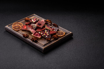 Bar sweet craft artisan chocolate with dried fruits made at home. Craft chocolate