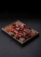 Bar sweet craft artisan chocolate with dried fruits made at home. Craft chocolate