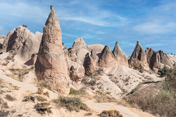 Very strange rock formations used as houses in Cappadocia, Anatolia, Turkey. 
Majestic view of lava flows that became rock caverns and pillars used to live inside.
