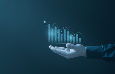 A glowing holographic bar chart and line graph with an upward arrow. The visual represents...