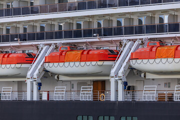 Bright Orange Lifeboats on the Deck of a Modern Cruise Ship