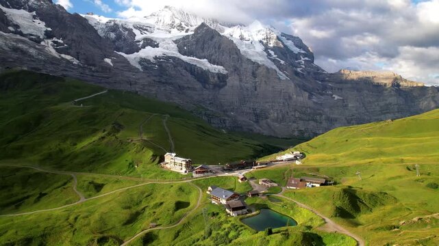  Swiss nature alpine landscape  . Kleine Scheidegg mountain pass that runs between the famous Eiger and the Lauberhorn famous for hiking in Bernese Alps mountains. Switzerland tourism