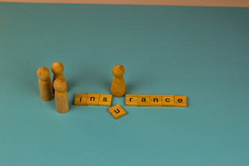 Wooden figures stand apart from the word 