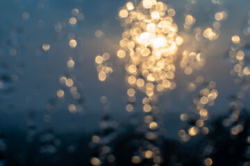 Golden light refracts through water