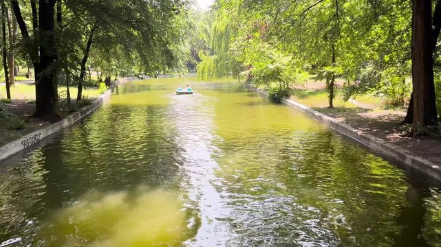Peaceful Paddleboat on Tranquil Lake