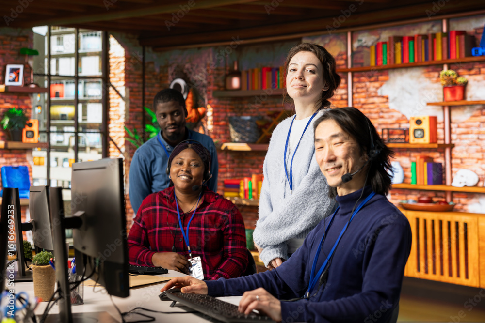 Poster portrait of joyful multiethnic call center agents in office providing step by step guidance to custo