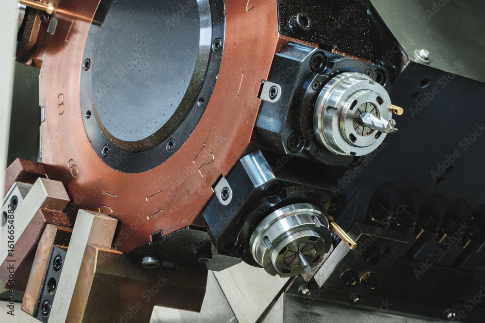 Aufkleber cnc machine with a brown casing and a silver part. machine is used for drilling. machine has a small