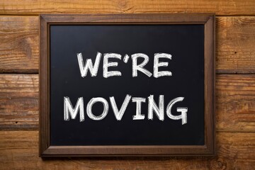 We're moving text with blackboard on wooden background.