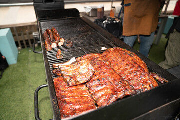 BBQ Checf prepares ribs in Brooklyn NYC on July 4th , 2025
