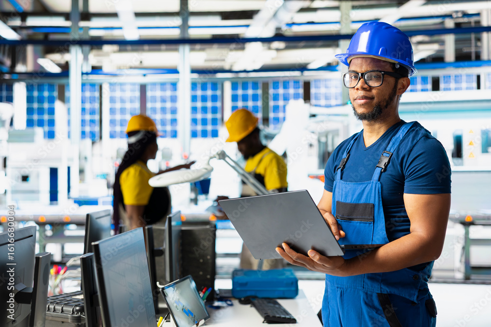 Poster solar power engineer updates design models in eco friendly factory with a focus on research and inno