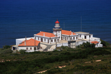 Portugal,  Figueira da Foz, Cape Mondego - Cabo Mondego lighthouse perched on enormous cliff...