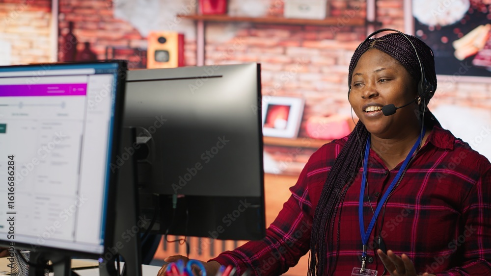 Poster call center worker tracking shipments at work, looking at computer screen, handling delivery delays.