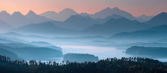 Fototapeta premium Misty mountain range over a valley